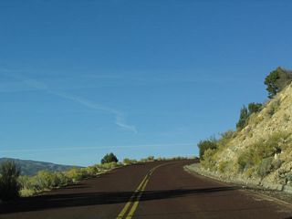 Almost immediately, this red-asphalt road ascends in elevation to reach the canyons. While the canyons are not visible from the freeway, they become evident as the scenic backway reaches the summit of this climb.