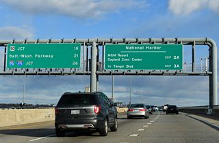 Interstate 95 parts ways with I-495 west in 26 miles for Baltimore. The succeeding ramps from the Local lanes connect with National Harbor.