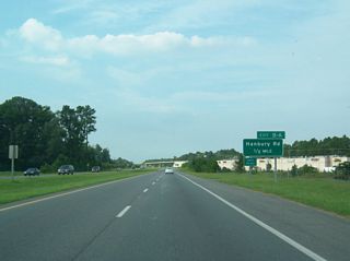Advancing north into Great Bridge SR 168 Business (Battlefield Boulevard) switches sides with the Chesapeake Expressway again ahead of Exit 10 for Hanbury Road.