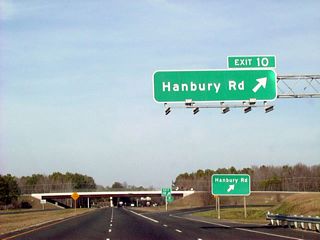 The original Great Bridge Bypass separated from Battlefield Boulevard at a wye interchange south of Exit 10. The six-ramp parclo interchange with Hanbury Road was constructed as part of the Chesapeake Expressway.