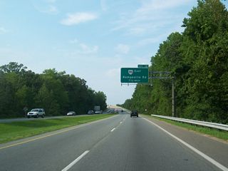 SR 168 (Great Bridge Bypass) spans the Albemarle and Chesapeake Canal (ICWW) north ahead of Exit 12 for SR 190 (Kempsville Road) east at Oak Grove.