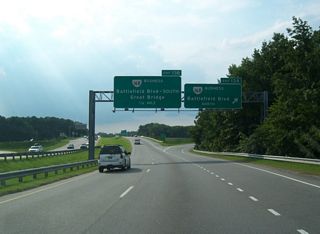 SR 168 Business (Battlefield Boulevard) continues another 2.99 miles north from Exit 13A to SR 168 at I-64 along a heavily developed commercial arterial.