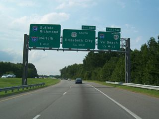 U.S. 17 converges with SR 168 (Oak Grove Connector) northeast at Exit 15B, ahead of the cloverleaf interchange with I-64/464. U.S. 17 was realigned eastward onto Dominion Boulevard (former SR 104) from the Dismal Swamp Canal in December 2001.