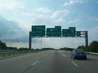Exit 15A takes SR 168 east from the Oak Grove Connector around the directional T interchange (Exit 15B) with U.S. 17 (Dominion Boulevard) directly onto I-64 east ahead of Battlefield Boulevard. Providing a direct route north to I-264 between Downtown Portsmouth and Norfolk, I-464 begins in one half mile.
