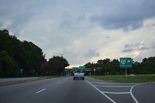 SR 168 Business (Battlefield Boulevard) enters a cloverleaf interchange with SR 168 (Great Bridge Bypass) north of SR 190 (Kempsville Road) at Oak Grove.