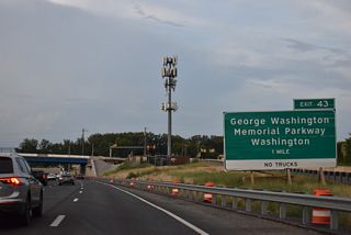 The succeeding exit from the Capital Beltway inner loop joins Interstate 495 with George Washington Memorial Parkway. Maintained by the National Park Service, the parkway is a limited access highway paralleling the western banks of the Potomac River between the Capital Beltway and Arlington.
