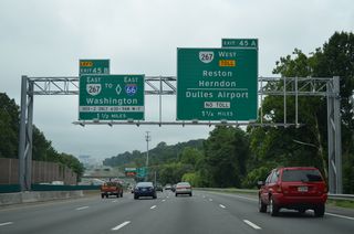 1.5 miles north of the directional interchange (Exits 45B/A) with SR 267 (Hirst Brault Expressway) and the Dulles Access Road.
