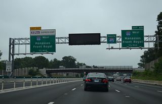 Ramps to Interstate 66 west exit from both the Capital Beltway mainline and the I-495 Express Lanes. I-66 passes between Vienna and Fairfax en route to Fair Oaks, Centreville and Manassas.