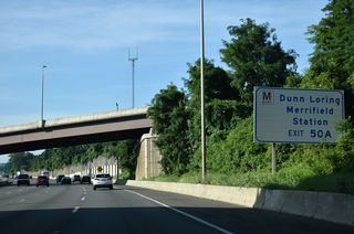 Interstate 495 advances south from I-66 one mile to a cloverleaf interchange with U.S. 50 (Arlington Boulevard).