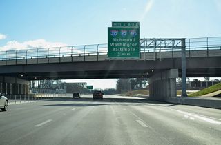 Interstate 495 turns southeasterly on the two mile approach to Exits 57A/B (I-95 and I-395 north).