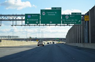 Exit 169B leaves the I-95 southbound ramp to join the right side of a six lane distributor roadway extending from I-395 south to SR 644.