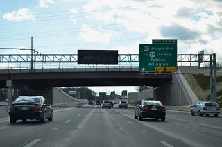 A collector distributor roadway (Exit 50) departs Interstate 495 south for U.S. 50 (Arlington Boulevard) at Merrifield.