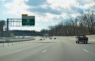 A flyover ramp elevates from the I-495 Express Lanes to cross over the I-495 southbound mainline to SR 620 (Braddock Road). SR 620 leads west to Ravensworth and east to Annandale.