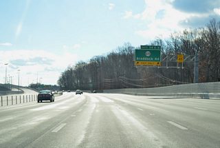 Two lanes branch away from the I-495 southbound mainline for Braddock Road. Braddock Road leads east to Lincolnia and west to Fairfax Station and SR 659 (Union Mill Road) near Centreville.