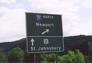 Button copy sign preceding the loop ramp connecting U.S. 2 east with Interstate 91 north to Newport.