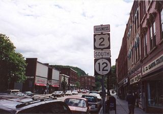 The previous confirming markers for U.S. 2 Business east and VT 12 south posted on Main Street.