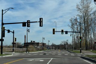 Champlain Parkway advances north from Flynn Avenue to an industrial area at Sears Lane.
