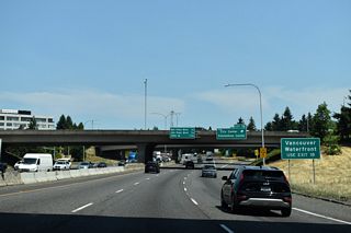 Exit 1 B follows from I-5 north to the Vancouver city center and the Vancouver Waterfront. The mixed-use development along the Columbia River west of the Interstate Bridge was the site of the Michigan Mill, which operated from 1889 to 2006. The property was purchased for redevelopment in 2008 (City of Vancouver, 2024).