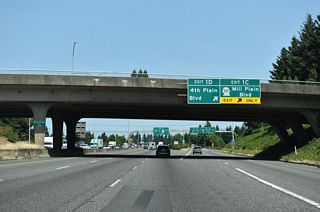 Exit 1 C is a diamond interchange joining I-5 with Mill Plain Boulevard. Leading to the Port of Vancouver, SR 501 follows 15th Street west through Downtown. Mill Plain Boulevard east runs between Central Park and Fort Vancouver National Historic Site.