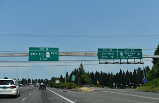 Exit 1 D forms a long distributor lane north across Mill Plain Boulevard to the parclo interchange with Fourth Plain Boulevard.