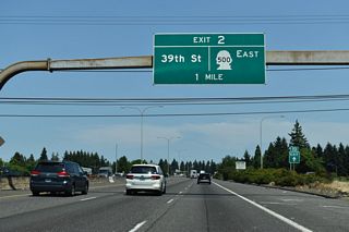 The freeway along SR 500 commences east from the wye interchange at forthcoming Exit 2.
