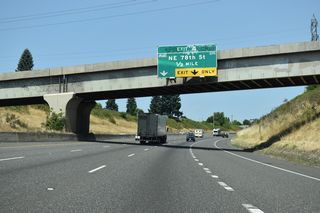I-5 leaves the Vancouver city limits at the Portland Vancouver Junction Railroad (formerly the Longview, Portland, and Northern) overpass. The high-voltage power lines and towers visible along this stretch connect with the Bonneville Power Administration's Ross Complex substation in Hazel Dell.