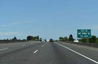 Interstate 5 proceeds 0.75 miles north from NE 78th Street to a SPUI (Exit 5) with NE 99th Street.