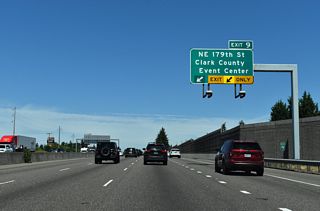 Previous guide signs referenced SR 502 and Ball Ground for Exit 9. SR 502 formerly ran north from Exit 9 along NE 10th Avenue to NE 219th street. The alignment changed when an extension of SR 502 west from Duluth to a new interchange at I-5 by the Gee Creek Rest Area opened in October 2008.