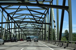 Underway from Spring 2023 to September 2024, a $17.4 million project extended the service life of the truss bridges across the North Fork Lewis River. Construction repaired the bridge deck, installed a polyester concrete overlay and made structural streel repairs (WSDOT, 2025).