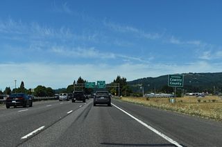 Horseshoe Lake along the west side of I-5 was the result of realigning the North Fork Lewis River. As such, the lake marks the Clark / Cowlitz County line. I-5 initially enters Cowlitz County ahead of Horseshoe Lake and then again at the north end of the lake and Woodland city limits.