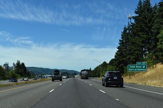 Grain silos and storage facilities at the Port of Kalama are visible on the west side of I-5. Formerly in view at Exit 27 also was a cooling tower of Oregon's mothballed Trojan Nuclear Power Plant. The tower was demolished in May 2006.