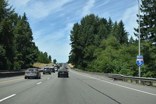 This Interstate 5 north confirming marker stands by Lacamas Creek.