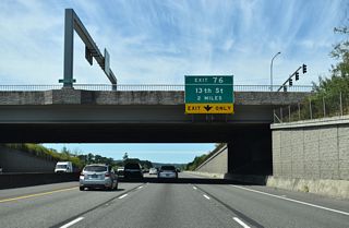 Signed for 13th Street, the first exit from I-5/U.S. 12 north in Chehalis is with Parkland Drive.