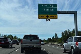 The overlay on this overhead for Exit 76 conceals &quot;Next Right&quot;. Parklane Drive south becomes Rice Road across Dillenbaugh Creek to nearby Stan Hedwell Park.