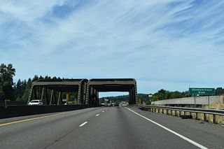 Just beyond the slip ramp at Exit 82, northbound Interstate 5 crosses the Skookumchuck River on a steel truss bridge. The adjacent distributor roadways utilize modern spans built in 2013.