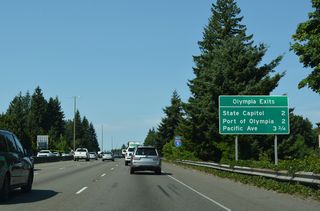 Interstate 5 turns northeast from U.S. 101 and Tumwater into the city of Olympia. Exit 105 to the State Capitol and Port of Olympia follows.