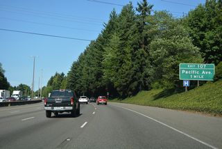 Pacific Avenue branches southeast from the couplet of 4th Avenue E (Old U.S. 99/410) and State Avenue NE to a parclo interchange (Exit 107) with Interstate 5 in east Olympia.