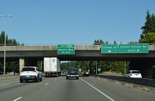 Martin Way (Old U.S. 99/410) east converges with Interstate 5 at a diamond interchange (Exit 109) in 0.75 miles.