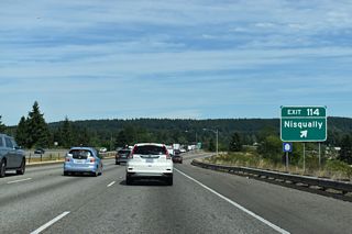 Nisqually Cut-Off Road leads south from I-5 toward Nisqually, which is along Old Pacific Highway. Guide signs for Exit 114 previously also displayed Old Nisqually.