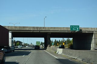 The west end of SR 512 ties into S Tacoma Way (Old U.S. 99/410) adjacent to the three quarter cloverleaf interchange with Interstate 5.