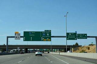 SR 16 travels west along a freeway from the systems interchange with I-5 to the Tacoma Narrows Bridge and Gig Harbor.