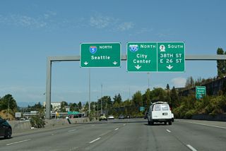 SR 7 initially follows a freeway spur south from I-705 through Tacoma Eastern Gulch to a partially built cloverleaf interchange with 38th Street.