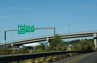 I-5 advances east to a split diamond interchange (Exit 134) with Portland Avenue just beyond the Tacoma city limits within the Puyallup Reservation.