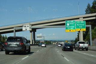 Exit 134 leaves Interstate 5 north at the L Street overpass for E 28th Street to Portland Avenue. 28th Street also connects with the wye interchange (Exit 135) where SR 167 eastbound begins.