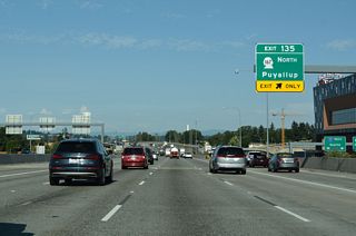 SR 167 (River Road) runs along the Puyallup River southeast to SR 161, where it dog legs north onto a freeway 6.50 miles from I-5. SR 167 heads north through Sumner, Auburn and Kent. The state route travels 28.6 miles between Tacoma and Renton, 19.26 miles of it along freeway.