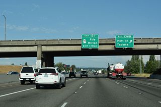 A loop ramp onto Port of Tacoma Road north follows at Exit 136 B. Port of Tacoma Road intersects Pacific Highway (Old U.S. 99) just north of Interstate 5 ahead of SR 509 and the Port of Tacoma.