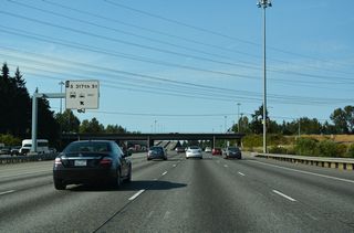 The HOV-2 lane also has an exit ramp for the Federal Way city center. Departing to the left, the ramp connects with an access road to a roundabout between S 317th Street and 28th Avenue S.