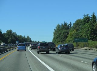 Vancouver, British Columbia debuted on Interstate 5 northbound distance signage on this assembly posted between SR 516 and the S 216th Street overpass. This sign was removed due to construction for the SR 509, I-5 to 24th Avenue South – Expressway Project.