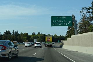 Exit 151 joins I-5 north with adjacent Military Road ahead of S 200th Street at Seatac. S 200th Street leads west to Normandy Park. Military Road continues northeast between Interstate 5 and Angle Lake to McMicken Heights in Seatac.