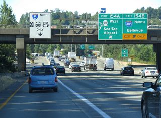 The HOV-2 lane separates through the cloverstack interchange with I-405 north and SR 518 west. The majority of I-405 and SR 518 was constructed between 1965-70.